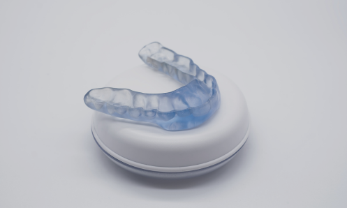 Dentist evaluating bite alignment for bruxism treatment